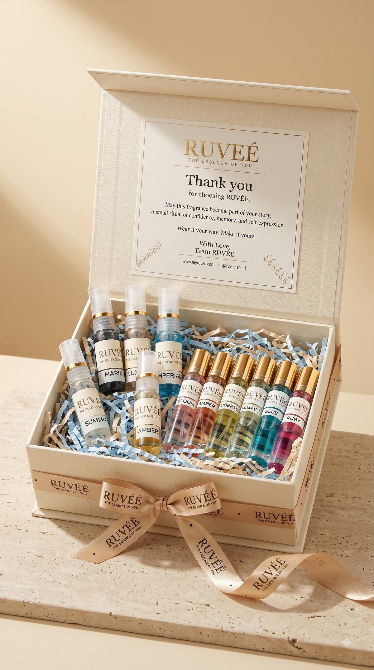 RUVEÉ premium cream gift box with Parfum vials and sprays, tied with a branded ribbon